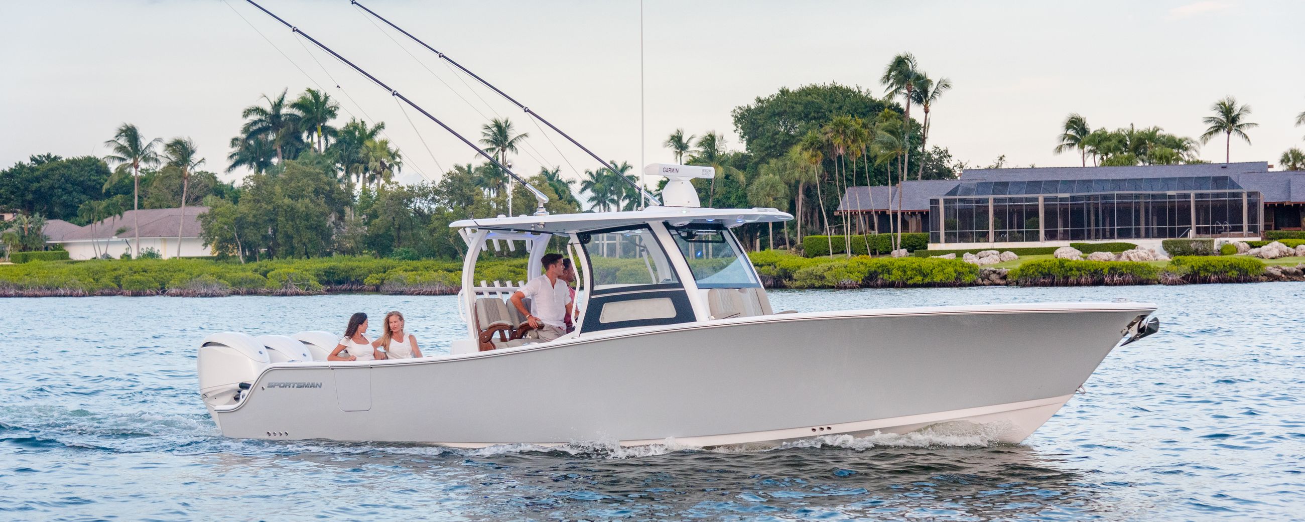 The all-new Open 352 Center Console running on the water with a family on board