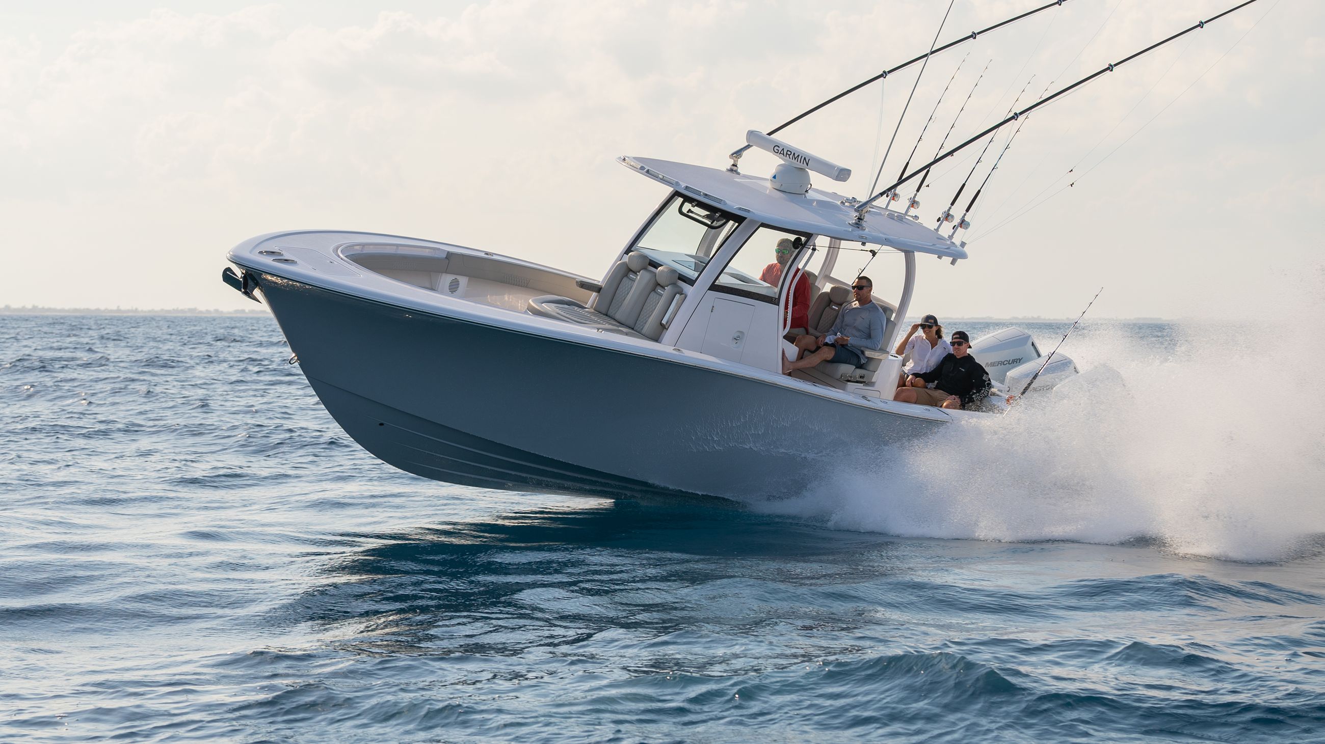 Family splashing around the Phenom 34 at the sandbar