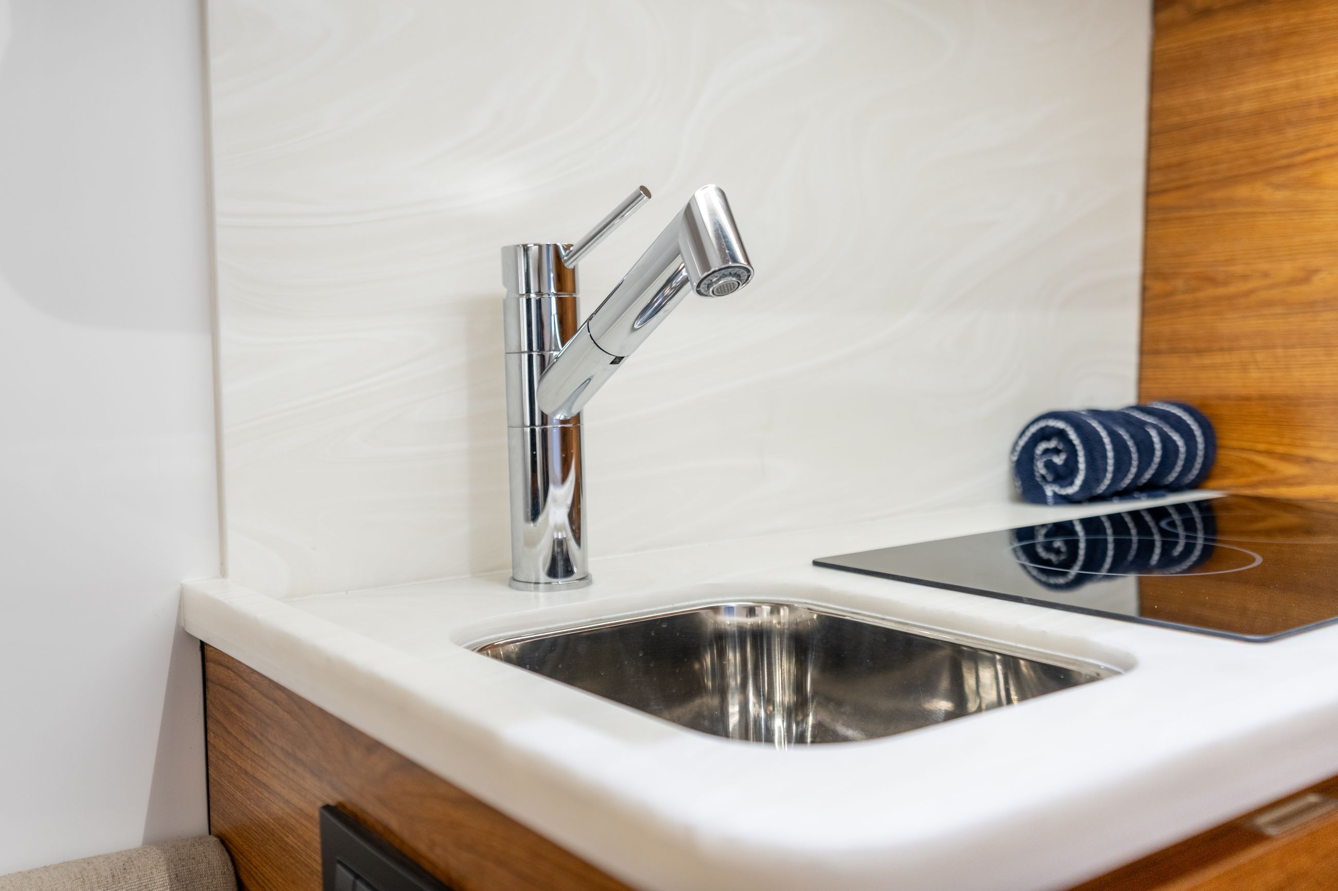 Large detail image of the Corian Countertop & Backsplash w/ SS Sink
